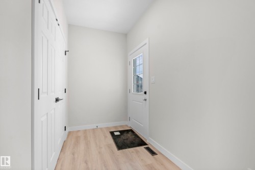 Entryway featuring light wood-finish flooring and a neutral color palette - 4915 17 Avenue, Edmonton, AB - Indoor Photo Showing Other Room