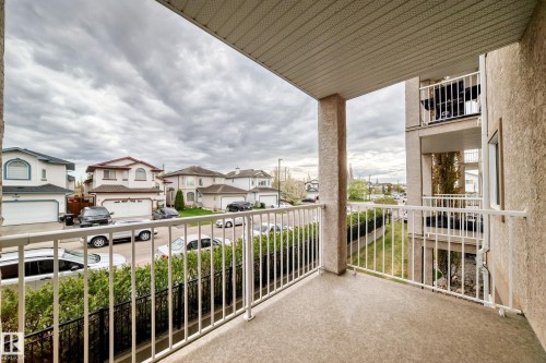 Private balcony featuring a textured concrete floor and white metal railing - 210 2305 35A Avenue, Edmonton, AB - Outdoor With Exterior