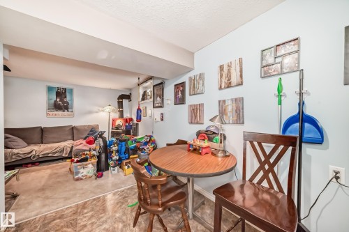 This versatile space features a neutral color palette, creating a flexible environment - 7723 82 Avenue, Edmonton, AB - Indoor Photo Showing Dining Room