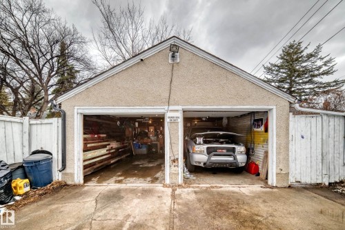A two-stall garage with stucco exterior and a pitched roof, offering convenient vehicle storage and additional workspace - 7723 82 Avenue, Edmonton, AB - Outdoor
