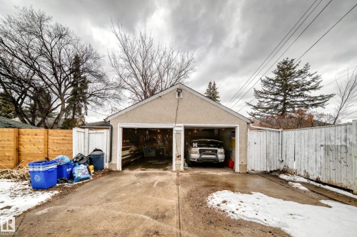 The property features a detached two-car garage with an asphalt driveway - 7723 82 Avenue, Edmonton, AB - Outdoor