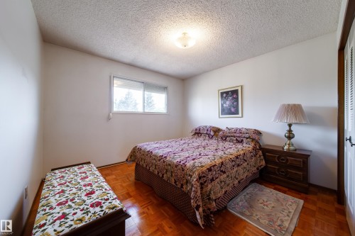 Interior room featuring light-colored walls and wood-finish flooring - 8509 39B Avenue, Edmonton, AB - Indoor Photo Showing Bedroom