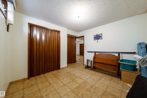 Neutral-toned tile flooring throughout - 8509 39B Avenue, Edmonton, AB - Indoor