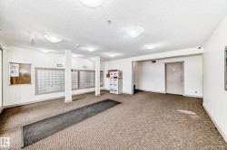 Building common area featuring white walls and a textured ceiling - 