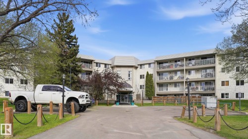 Multi-story building featuring multiple private balconies with glass railings - 105 5125 Riverbend Road, Edmonton, AB - Outdoor With Facade
