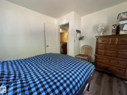 White walls complement the dark wood-finish flooring - 