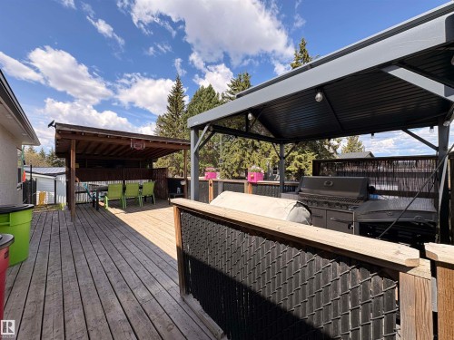 Expansive wooden deck featuring multiple covered outdoor areas - 5510 Railway Avenue, Glendon, AB - Outdoor With Deck Patio Veranda With Exterior