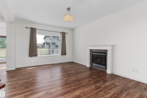 583 Leger Way, Edmonton, AB - Indoor Photo Showing Living Room With Fireplace