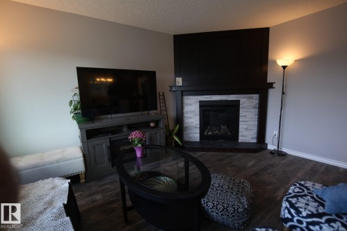44 Wellington Crescent, Spruce Grove, AB - Indoor Photo Showing Living Room With Fireplace