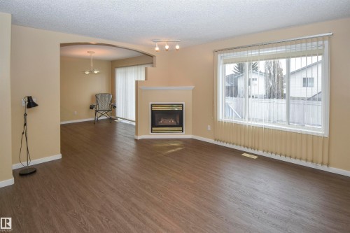 4112 37A Avenue, Edmonton, AB - Indoor Photo Showing Living Room With Fireplace