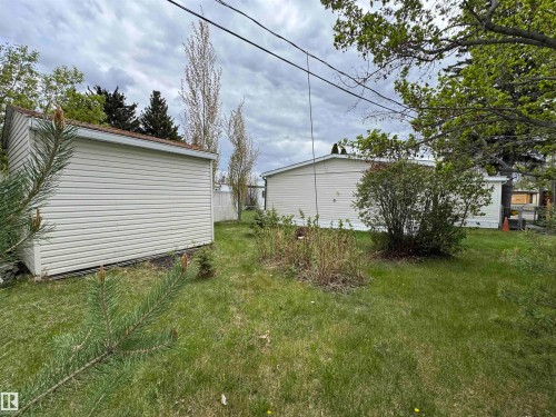 Detached shed with horizontal siding and a shingle roof - #46 4204 47 St, Wetaskiwin, AB - Outdoor