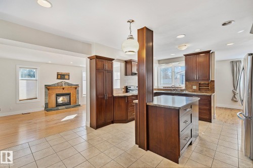 10823 130 Street, Edmonton, AB - Indoor Photo Showing Kitchen With Fireplace