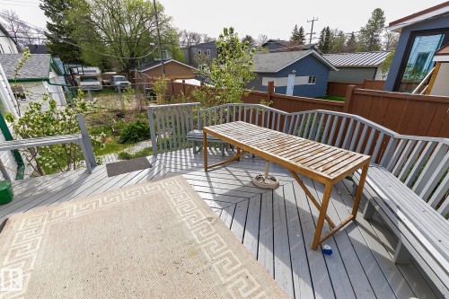 Multi-level outdoor deck featuring a gray finish and integrated railing - 10823 130 Street, Edmonton, AB - Outdoor With Deck Patio Veranda With Exterior