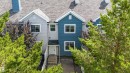 Multi-level townhouse exterior featuring blue and light gray siding, white trim, and a gray shingle roof - 41 8304 11 Avenue, Edmonton, AB  - Outdoor 