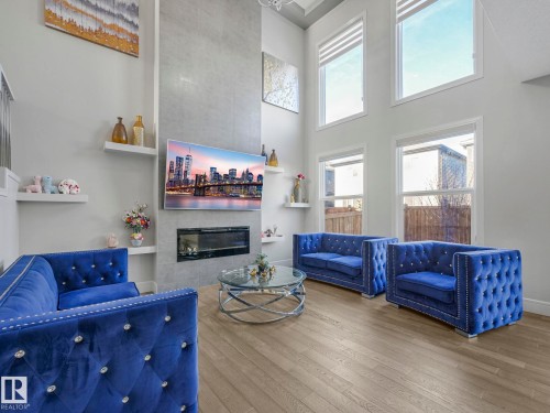 8641 Mayday Wynd, Edmonton, AB - Indoor Photo Showing Living Room With Fireplace