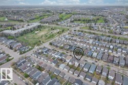 Aerial perspective showcasing a residential neighborhood with detached homes - 