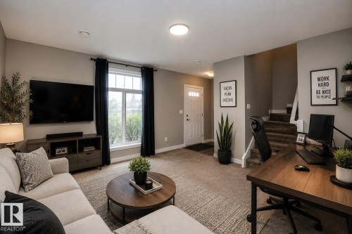 Open-concept living area with neutral wall tones and carpeted flooring - 117 Callaghan Drive Sw, Edmonton, AB - Indoor Photo Showing Living Room