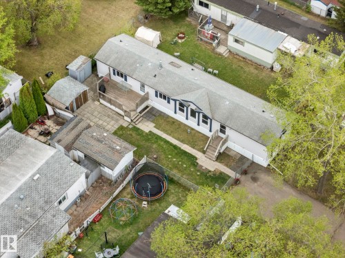 Aerial perspective showcasing a single-story residence with a light-colored exterior and dark trim accents - 49 Rim Road Nw, Edmonton, AB - Outdoor With View