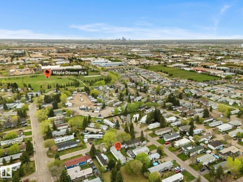 Aerial perspective showcasing a residential community with abundant green spaces and tree-lined streets - 49 Rim Road Nw, Edmonton, AB - Outdoor With View