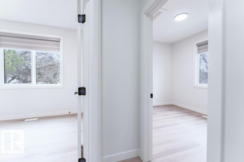 Crisp white interior walls - 6920/6922 106 Street, Edmonton, AB - Indoor Photo Showing Other Room
