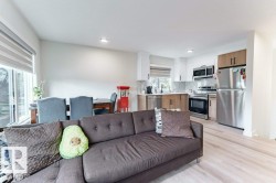 Open concept living area featuring light wood-finish flooring - 