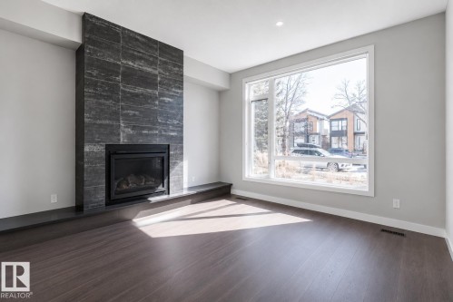 11430 75 Avenue, Edmonton, AB - Indoor Photo Showing Living Room With Fireplace