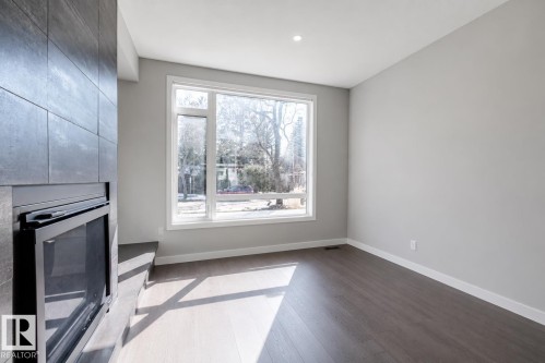 11430 75 Avenue, Edmonton, AB - Indoor Photo Showing Other Room With Fireplace