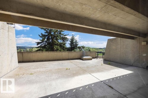 Concrete patio area with a partial overhead structure - 1208 9918 101 Street, Edmonton, AB - Outdoor
