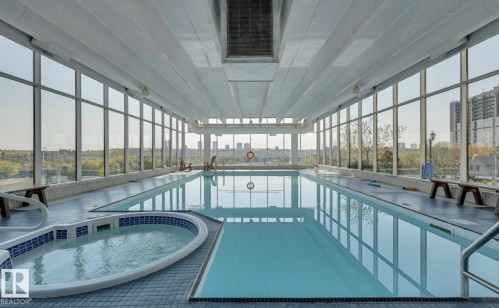 Indoor swimming pool featuring a connected whirlpool - 1208 9918 101 Street, Edmonton, AB - Indoor Photo Showing Other Room With In Ground Pool
