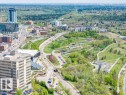 Aerial perspective showcasing urban and natural landscapes with extensive tree coverage - 1208 9918 101 Street, Edmonton, AB  - Outdoor With View 
