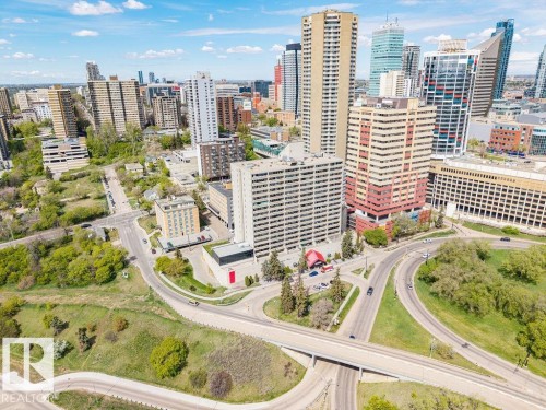 Expansive urban landscape featuring multiple high-rise buildings, extensive road infrastructure, and natural green spaces with mature trees - 1208 9918 101 Street, Edmonton, AB - Outdoor With View