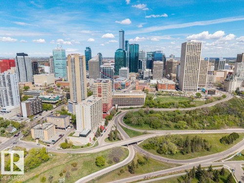 Panoramic city skyline featuring numerous high-rise buildings and a multi-lane highway system - 1208 9918 101 Street, Edmonton, AB - Outdoor With View