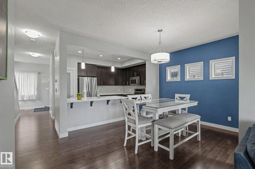 Open-concept dining area with wood-finish flooring - 18144 76 Street, Edmonton, AB - Indoor Photo Showing Dining Room