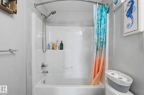 White fiberglass tub and shower combination with chrome fixtures - 18144 76 Street, Edmonton, AB - Indoor Photo Showing Bathroom