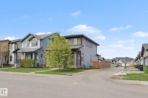 Contemporary two-story residence featuring light blue siding with white trim accents and a dark-toned roof - 18144 76 Street, Edmonton, AB - Outdoor With Facade