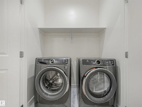 Image quality insufficient for description - 1518 Siskin Link Link, Edmonton, AB - Indoor Photo Showing Laundry Room