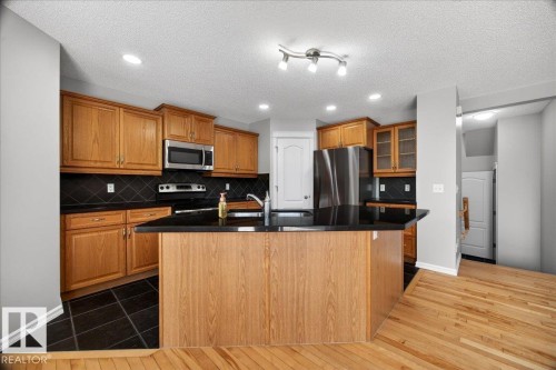 83 Becker Crescent, Fort Saskatchewan, AB - Indoor Photo Showing Kitchen With Double Sink