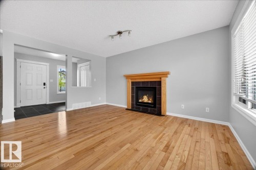 83 Becker Crescent, Fort Saskatchewan, AB - Indoor Photo Showing Living Room With Fireplace