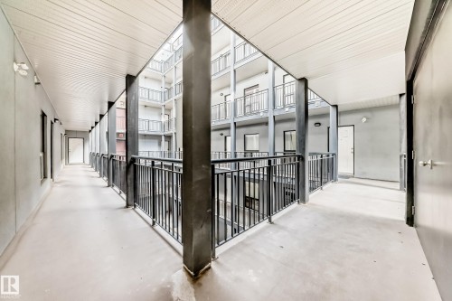 Multi-story building featuring an interior courtyard design with open-air corridors - 316 10518 113 Street, Edmonton, AB -  Photo Showing Other Room