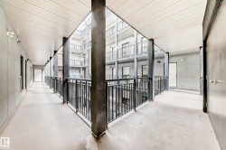 Multi-story building featuring an interior courtyard design with open-air corridors - 