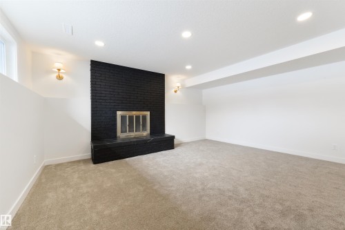 3 Linthorpe Road, Spruce Grove, AB - Indoor Photo Showing Other Room With Fireplace