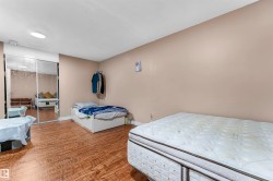 Room featuring wood-finish flooring and neutral-toned walls - 