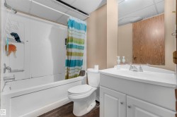 White tub and shower combination with a single handle fixture - 