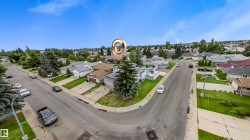 Corner lot property with a mature evergreen tree - 