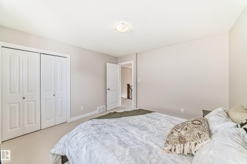 Neutral-toned interior with carpet flooring and white baseboards - 1330 114B Street, Edmonton, AB - Indoor Photo Showing Bedroom