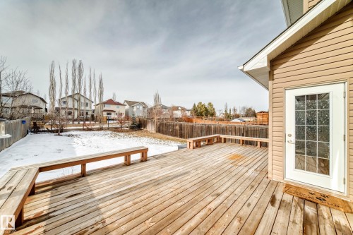 Spacious wood deck with integrated bench seating, providing an expansive outdoor area - 1330 114B Street, Edmonton, AB - Outdoor With Deck Patio Veranda With Exterior