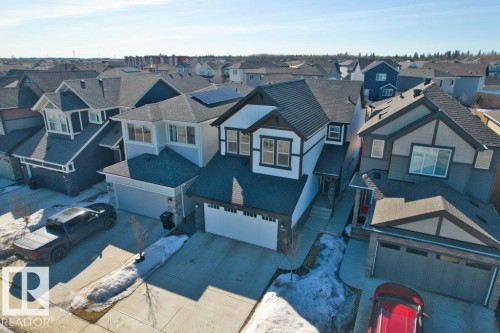 Modern two-story residence featuring a dark shingle roof and a two-car garage - 21003 131 Avenue, Edmonton, AB 