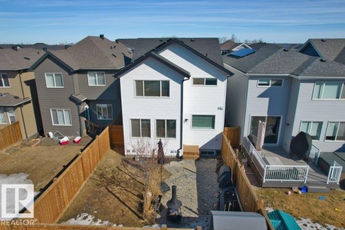 Rear exterior with white siding and dark trim - 21003 131 Avenue, Edmonton, AB 