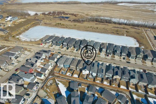 Aerial perspective showcasing the residential neighborhood with a frozen body of water - 21003 131 Avenue, Edmonton, AB 
