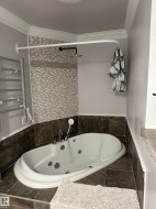 Soaking tub with integrated jets and chrome fixtures - 